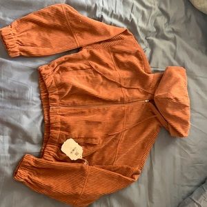 Coral colored cropped jacket from altered state